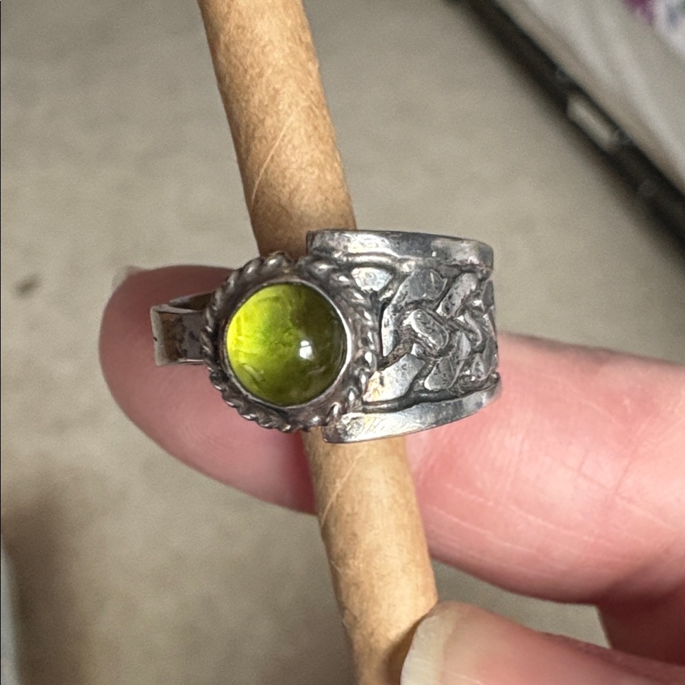 Asymetrical Silver Celtic Knot Ring with Peridot Stone